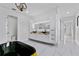 Modern bathroom with sleek black soaking tub, dual vessel sinks, and marble floors at 2121 Bayou Grande Ne Blvd, St Petersburg, FL 33703
