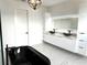 Modern bathroom boasts dual vessel sinks, marble countertops, and a sleek black soaking tub at 2121 Bayou Grande Ne Blvd, St Petersburg, FL 33703
