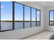 Stunning water view through large windows in a serene bedroom, providing a tranquil and picturesque living experience at 2121 Bayou Grande Ne Blvd, St Petersburg, FL 33703