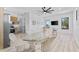 Open-concept dining area with modern furnishings and abundant natural light at 2121 Bayou Grande Ne Blvd, St Petersburg, FL 33703
