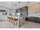 Spacious modern kitchen with a large island, bar stool seating, stainless steel appliances, and elegant pendant lighting at 2121 Bayou Grande Ne Blvd, St Petersburg, FL 33703