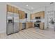 Kitchen with stainless steel appliances and wooden cabinets at 2121 Bayou Grande Ne Blvd, St Petersburg, FL 33703
