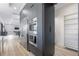 Modern kitchen featuring stainless steel appliances and access to the living room at 2121 Bayou Grande Ne Blvd, St Petersburg, FL 33703