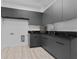 Laundry room with dark gray cabinets and marble countertop at 2121 Bayou Grande Ne Blvd, St Petersburg, FL 33703