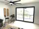Bright living room boasts a large sliding door leading to a deck and a bistro table at 2121 Bayou Grande Ne Blvd, St Petersburg, FL 33703