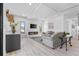 Bright living room boasting a fireplace, white walls, and light wood floors at 2121 Bayou Grande Ne Blvd, St Petersburg, FL 33703