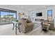 Inviting living room with fireplace, wet bar, and expansive glass doors to lanai at 2121 Bayou Grande Ne Blvd, St Petersburg, FL 33703