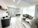 A cozy living room offers a modern fireplace, comfortable seating, and a bar area at 2121 Bayou Grande Ne Blvd, St Petersburg, FL 33703