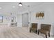 The spacious main bedroom is bright and airy with white walls, neutral decor, and sleek hardwood floors at 2121 Bayou Grande Ne Blvd, St Petersburg, FL 33703