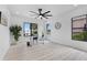 Bright office space featuring a desk, natural light, and a ceiling fan, creating a productive and comfortable workspace at 2121 Bayou Grande Ne Blvd, St Petersburg, FL 33703