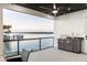 Enjoy this expansive patio with outdoor kitchen, ceiling fan, and views of the beautiful waterfront at 2121 Bayou Grande Ne Blvd, St Petersburg, FL 33703