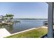 Breathtaking water view from the property showcasing a dock, boats, and lush green islands at 2121 Bayou Grande Ne Blvd, St Petersburg, FL 33703