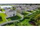 Aerial view of houses with fenced backyards backing up to a canal at 105 Cascade Bend Dr, Ruskin, FL 33570