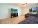 Gathering room with sectional sofa and large TV at 105 Cascade Bend Dr, Ruskin, FL 33570