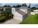 Two-story house with attached garage and landscaped lawn at 105 Cascade Bend Dr, Ruskin, FL 33570