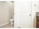Small half bathroom with toilet and tile flooring at 105 Cascade Bend Dr, Ruskin, FL 33570