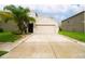 Two-story house with attached garage and well-maintained lawn at 105 Cascade Bend Dr, Ruskin, FL 33570