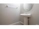 Small powder room with pedestal sink and mirror at 105 Cascade Bend Dr, Ruskin, FL 33570