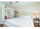 Spacious bedroom with a king-size bed and access to a bathroom at 1180 Gulf Blvd # 1805, Clearwater Beach, FL 33767