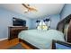 Bright bedroom with wood floors, ceiling fan and large window at 2323 Feather Sound Dr # 202, Clearwater, FL 33762