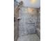Large walk-in shower with tiled walls and built-in seat at 2323 Feather Sound Dr # 202, Clearwater, FL 33762