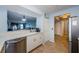 Modern kitchen with white cabinets, stainless steel appliances and a breakfast bar at 2323 Feather Sound Dr # 202, Clearwater, FL 33762