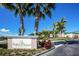 Feather Sound Country Club entrance sign and building, palm trees, and landscaping at 2323 Feather Sound Dr # 202, Clearwater, FL 33762
