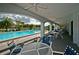 Covered pool deck with tables and chairs at 2323 Feather Sound Dr # 202, Clearwater, FL 33762