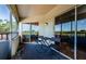 Private screened balcony with outdoor table and chairs at 2323 Feather Sound Dr # 202, Clearwater, FL 33762