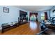 Living room with fireplace, hardwood floors, and balcony access at 2323 Feather Sound Dr # 202, Clearwater, FL 33762