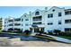 Condo building with attractive exterior and landscaping at 2323 Feather Sound Dr # 202, Clearwater, FL 33762
