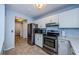 Updated kitchen with stainless steel appliances and white cabinetry at 2323 Feather Sound Dr # 202, Clearwater, FL 33762