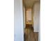 Light-filled hallway with wood-look floors and access to multiple rooms at 6100 12Th S St # 310, St Petersburg, FL 33705