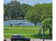 Well-maintained tennis courts nestled within a tree-lined park at 6100 12Th S St # 310, St Petersburg, FL 33705