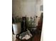Small laundry area with water heater and storage at 2317 8Th E Ave, Bradenton, FL 34208