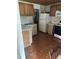 Kitchen with wood cabinets, double sink, and appliances at 2317 8Th E Ave, Bradenton, FL 34208