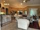 Open-concept living space with a view of the dining area and kitchen at 21039 Los Cabos Ct, Land O Lakes, FL 34637