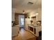 Functional kitchen with white appliances, tile flooring and access to door at 824 62Nd Ne Ave, St Petersburg, FL 33702