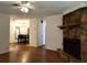 Open-concept living room with fireplace and view into dining area at 824 62Nd Ne Ave, St Petersburg, FL 33702