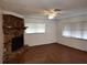 Spacious living room with hardwood floors and a stone fireplace at 824 62Nd Ne Ave, St Petersburg, FL 33702