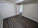 Bright bedroom with dark wood-look flooring and double doors at 1720 Granville S Ct, St Petersburg, FL 33701