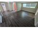 Spacious living area with dark wood-look flooring at 1720 Granville S Ct, St Petersburg, FL 33701