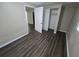 Bedroom with dark wood-look flooring and closet at 1720 Granville S Ct, St Petersburg, FL 33701