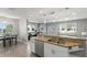 Open concept kitchen with island and stainless steel appliances at 2376 Hanover Dr, Dunedin, FL 34698