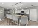 Modern kitchen boasts granite countertops, stainless steel appliances, and a breakfast bar at 2376 Hanover Dr, Dunedin, FL 34698