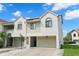 Two-story townhome with attached garage and landscaping at 2376 Hanover Dr, Dunedin, FL 34698