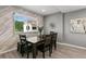 Bright dining room with wood table and chairs, and an accent wall at 2376 Hanover Dr, Dunedin, FL 34698