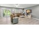 Living room with sectional sofa and access to patio at 2376 Hanover Dr, Dunedin, FL 34698