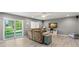 Spacious living room with hardwood floors and sliding glass doors at 2376 Hanover Dr, Dunedin, FL 34698