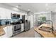 Modern kitchen with stainless steel appliances and granite countertops at 2376 Hanover Dr, Dunedin, FL 34698
